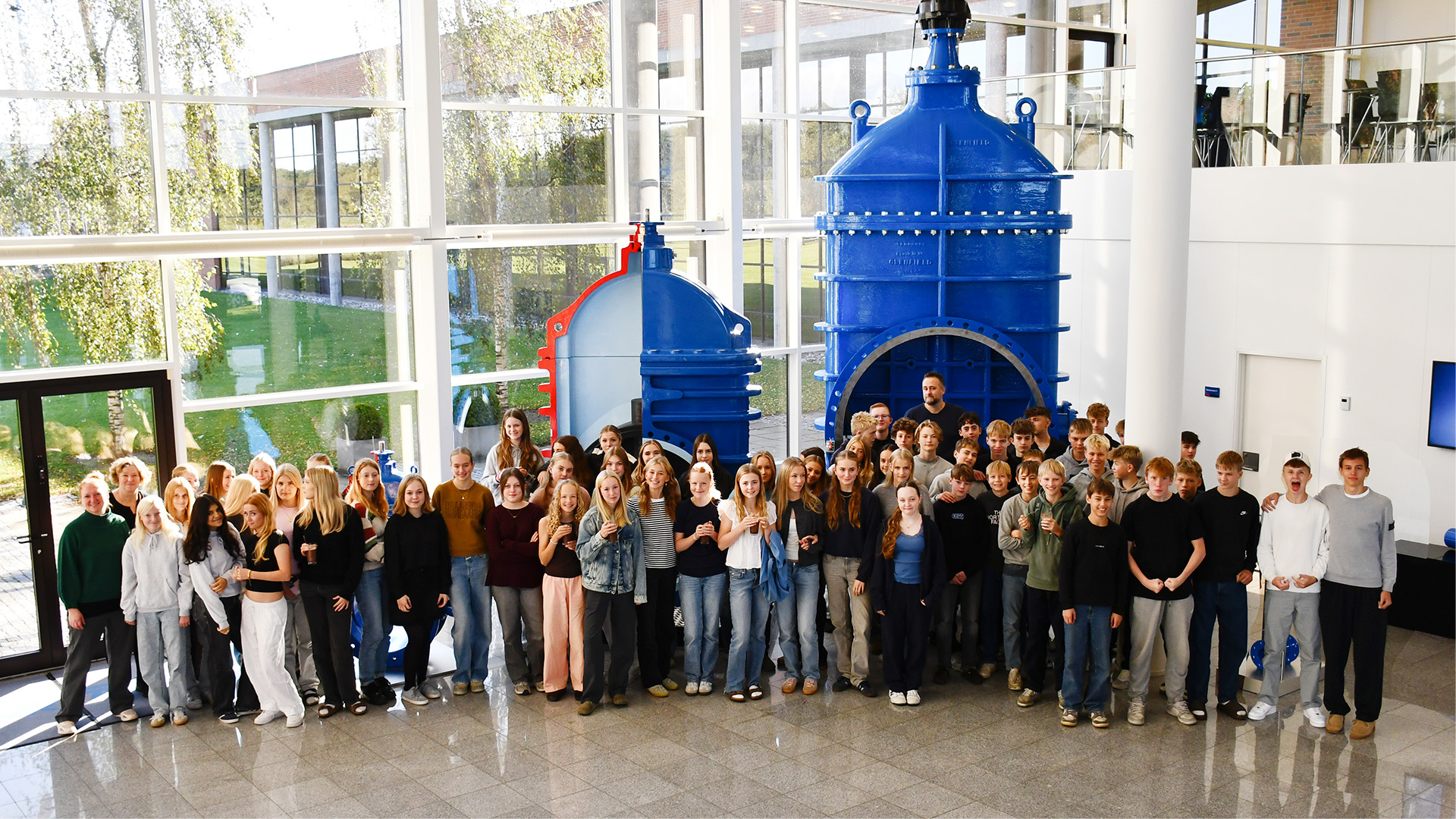 Science day showing school kids in front of a big blue valve